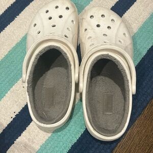 White and gray fuzzy Croc shoes